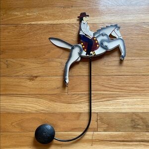 Vintage Metal Folk Art Cowboy/Horse Jumper that Stays Balanced as it Moves